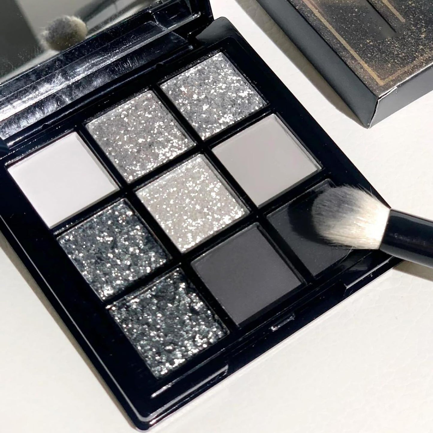 Smokey Silver Glitter Eyeshadow Palette - 9 Shades Of White, Grey & Matte Cool Tones. Long-Lasting, Waterproof Gothic Makeup Palette For Women. Perfect For Smoky Eye Looks & Bold Styles
