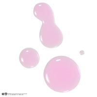 Lottie London x Harley Quinn Puddin’ pH Color Changing Lip Oil in Pink, Nourishing lip oil to adapt to the natural pH in your lips for a unique flush of color