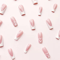 Shengqialun Pink Press on Nails, Long Coffin False Nails - French Tip Pink & White Fake Nail with Heart Accents, 24pcs Full Cover Stick on Nails with Glue, Glossy Elegant Press-Ons for Parties