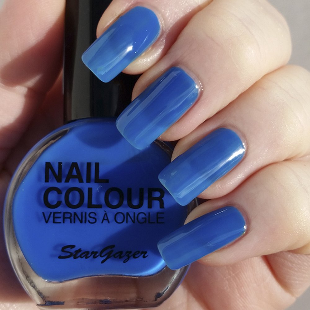 Neon Blue UV reactive nail polish. Bright nail polish that glows under uv neon light.
