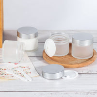 SHiZAK 6 Pack, 2 oz 60ml Frosted Glass Jars with Silver Lids & Inner Liners, Empty Matte Clear Round Refillable Cosmetic Containers Travel Jars for Cosmetics,Body Face Cream Lotion